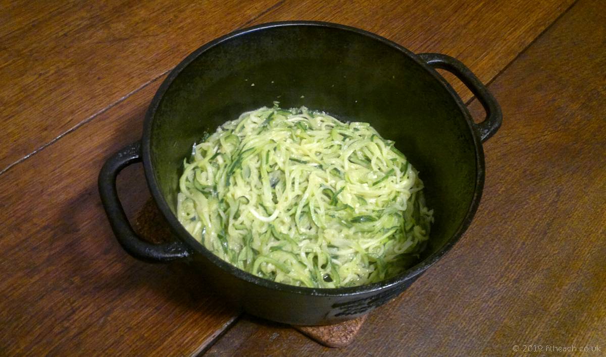 Finished cooked courgetti in a heavy pan